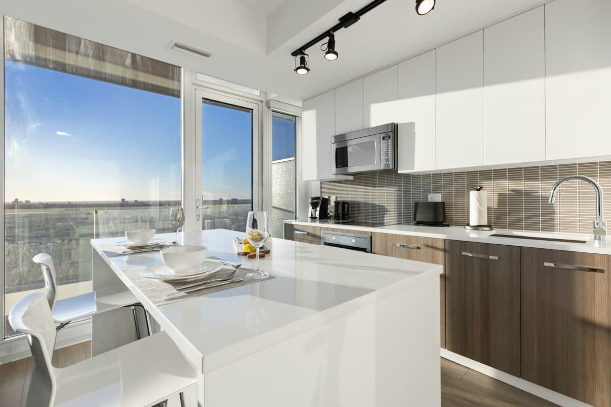 A modern kitchen with painted white cabinets